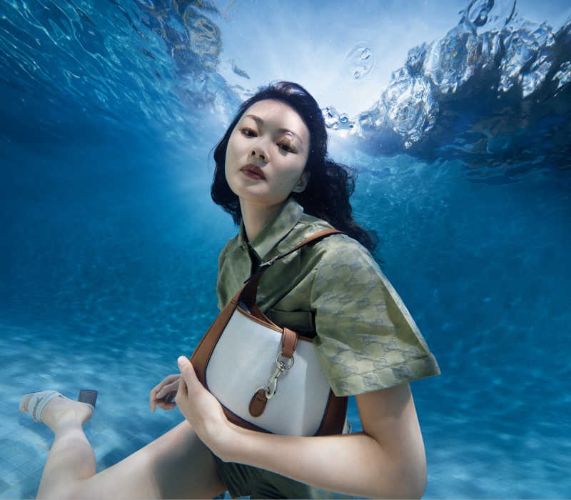 He Cong takes a dive underwater in Gucci Lido's summer 2024 collection.
