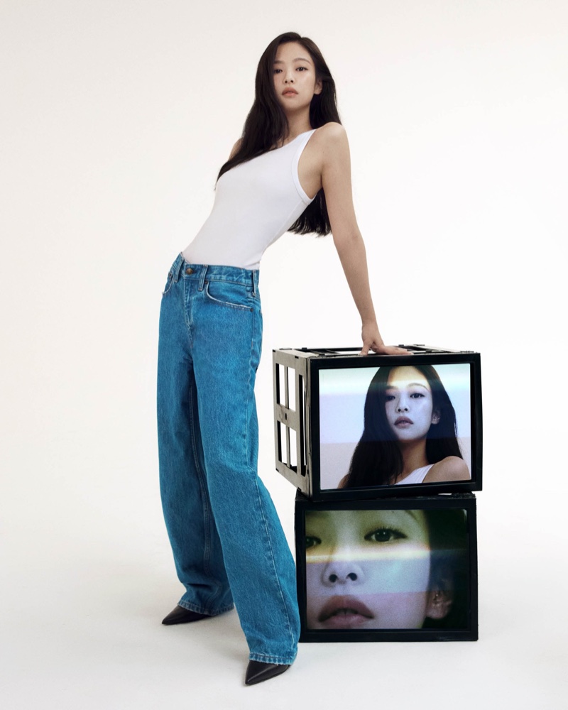 Channeling casual cool, Jennie pairs Calvin Klein 90s-style jeans with a crisp white tank for spring 2024 denim ad.