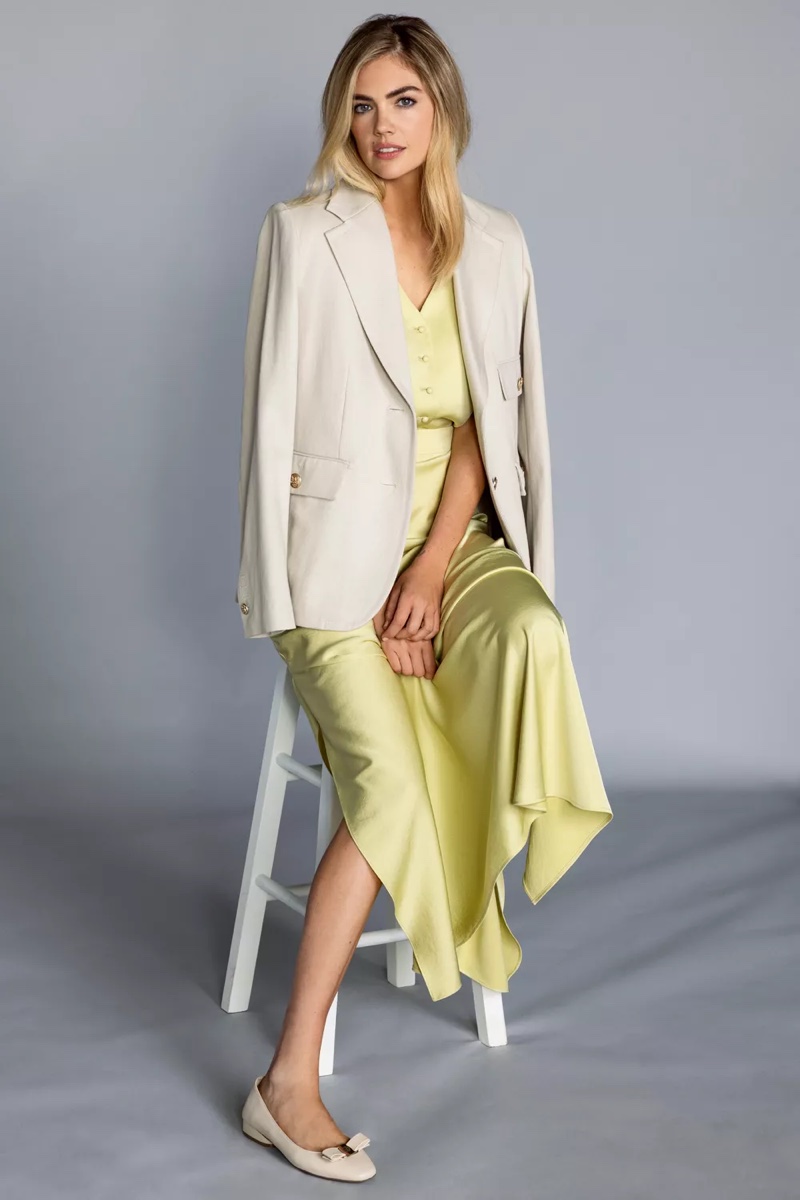 Kate Upton pairs a soft yellow ensemble with Anne Klein's signature tailored blazer for spring 2024 campaign.