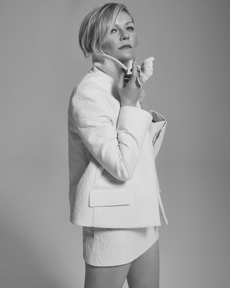 Showcasing minimalist chic, Kirsten Dunst wears a textured white ensemble.