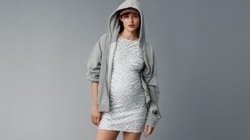 Michael Kors showcases a fusion of comfort and glamour, featuring Grace Elizabeth in a sequined dress and hoodie for Mother's Day 2024.