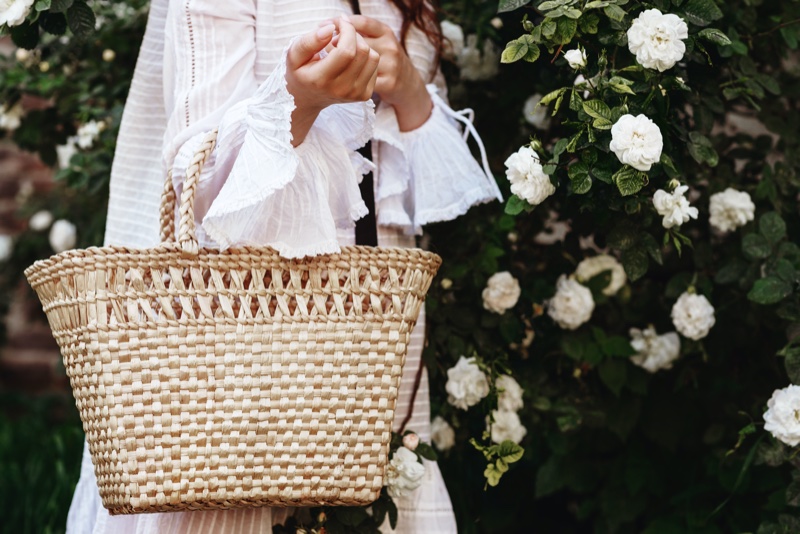 Embrace the season's fresh start with a stylish straw bag.