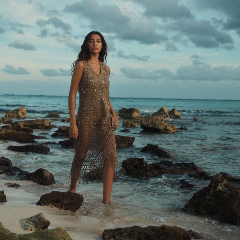 Elevating beachside glamour, a knit dress from Brunello Cucinelli's summer 2024 line captures getaway chic.