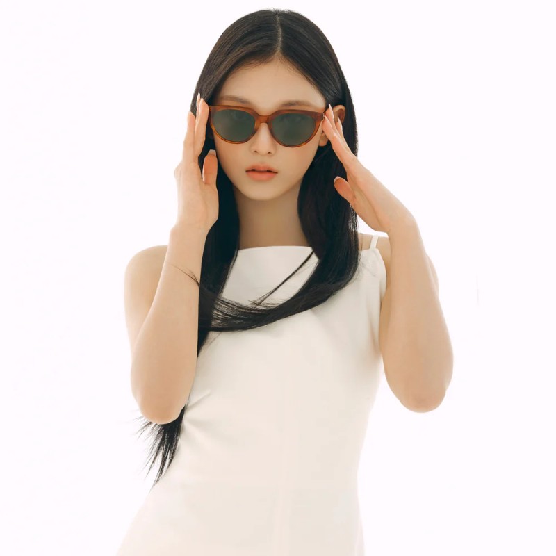 Haerin models the Kristen N sunglasses in a white dress for Carin campaign.