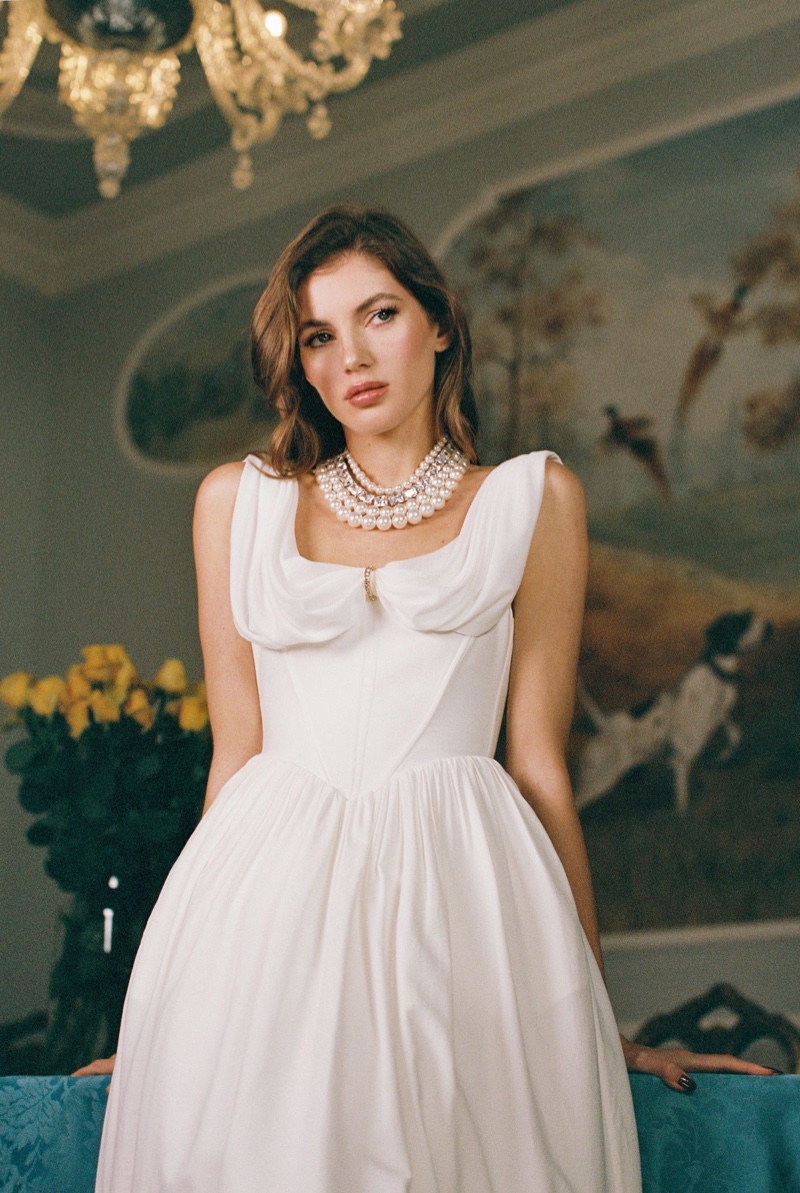 Nana Jacqueline's Bianco Bridal 2024 collection highlights the Vivian dress paired with a pearl necklace.