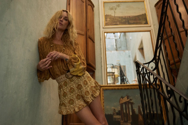 Wearing a printed blouse and shorts, Erin Wasson poses in Spell's recent collection.