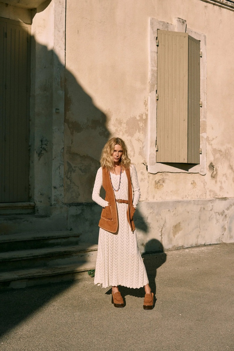 Erin Wasson stands poised in a textured knit dress and suede vest for Spell's latest collection.