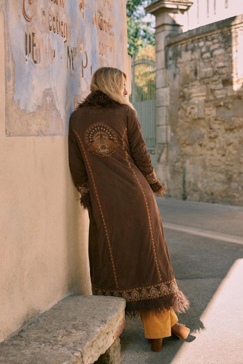 Model Erin Wasson showcases a detailed, embroidered coat from Spell.