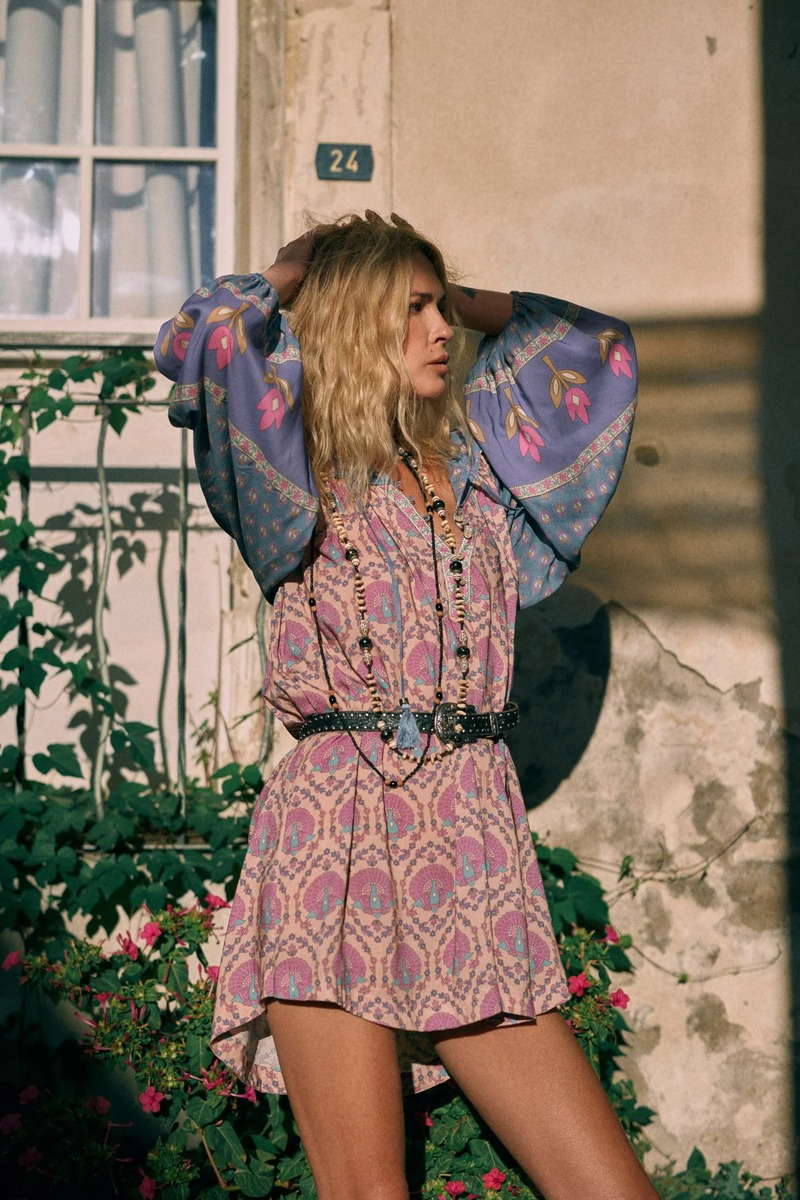 Model Erin Wasson radiates in a vibrant patterned mini dress with voluminous sleeves for the Spell.