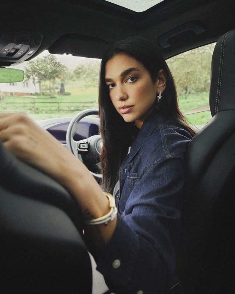 Dua Lipa poses in the Porsche Cayenne Turbo E-Hybrid.